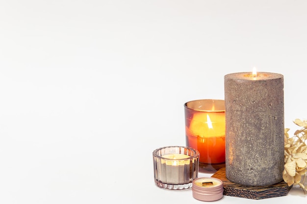 Burning candles on a white background isolated