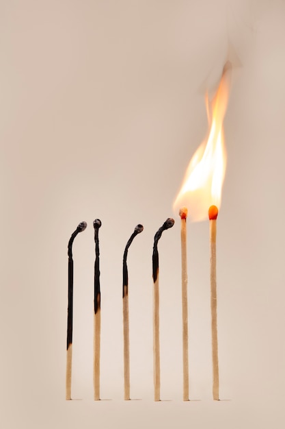 Free photo burning matches arrangement still life