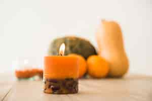 Free photo burning orange candle