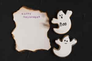 Free photo burning paper near ghost gingerbread