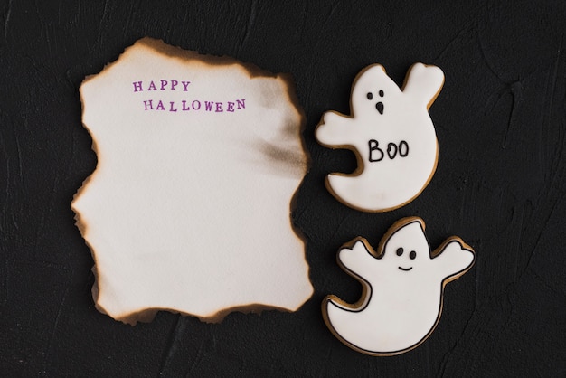 Free Photo burning paper near ghost gingerbread 