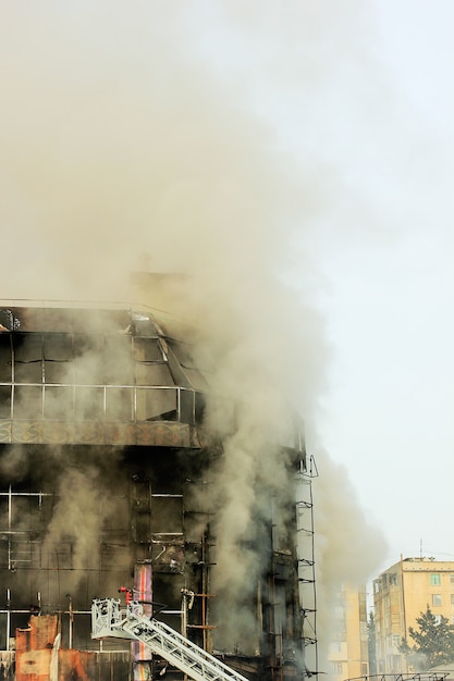 Burning shopping center or mall with smoke