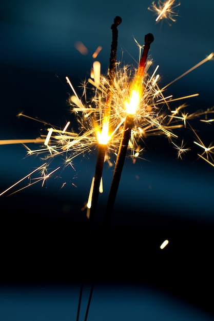 Free photo burning sparklers in night