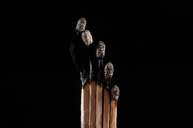 Free Photo burnt matches with dark background