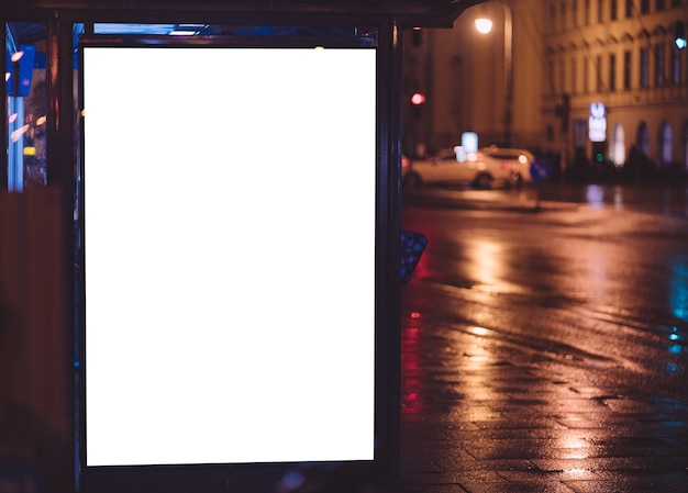 Free photo bus stop during night with ad space