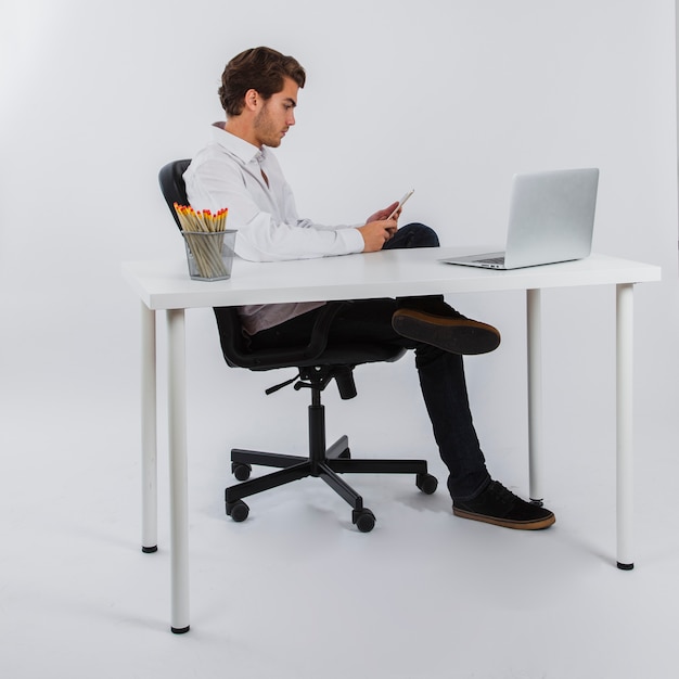 Businesman relaxing at his desk