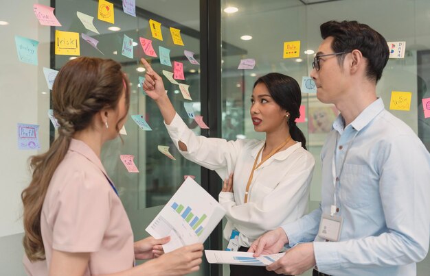 Business asian people meeting at office and use post it notes to share idea Brainstorming