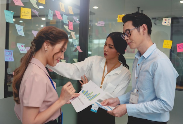 Business asian people meeting at office and use post it notes to share idea Brainstorming