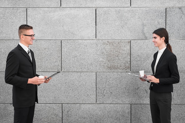 Business couple talking to each other