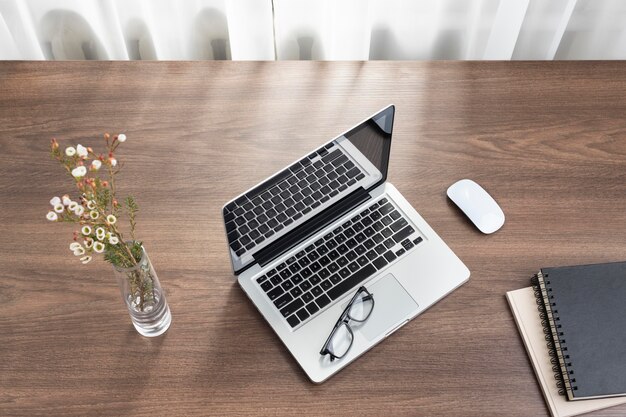 Business desk arrangement with laptop top view