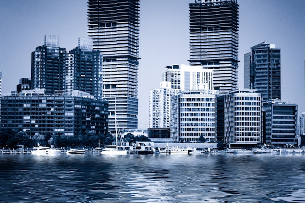 Free Photo business district cityscape from a park with blue sky