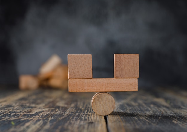 Business and financial accounting concept with wooden blocks side view.