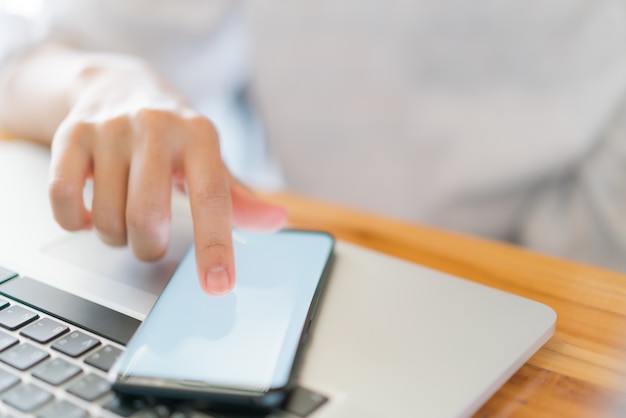 Business hand with mobile phone .