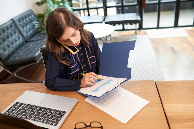 Business lady analyzing financial chart