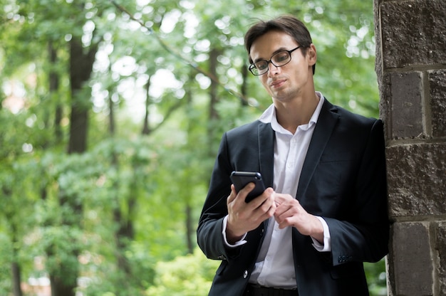 Business man checking his phone