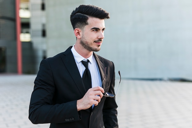 Business man in front of the office building