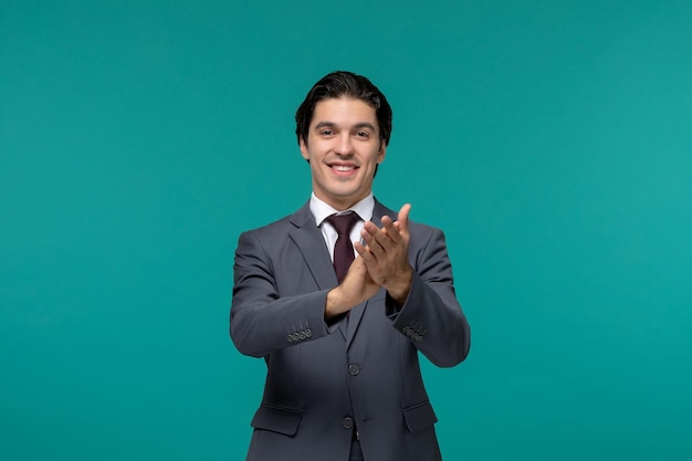 Business man handsome cute brunette guy in grey office suit and tie clapping hands