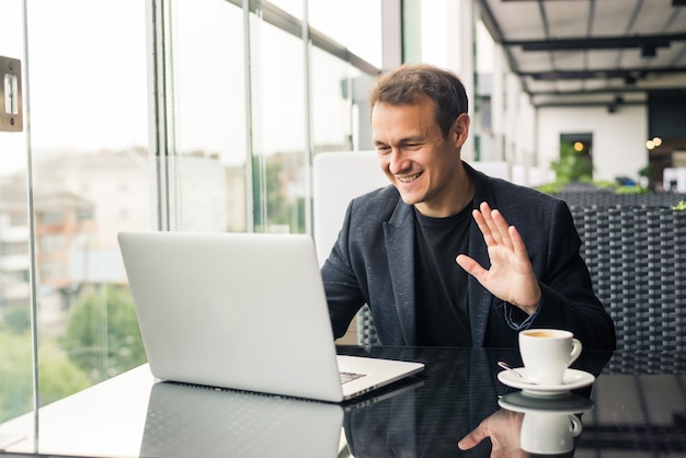 Business man have business meeting via video call in a cafe