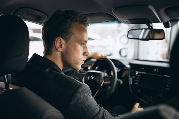 Business man sitting in a car