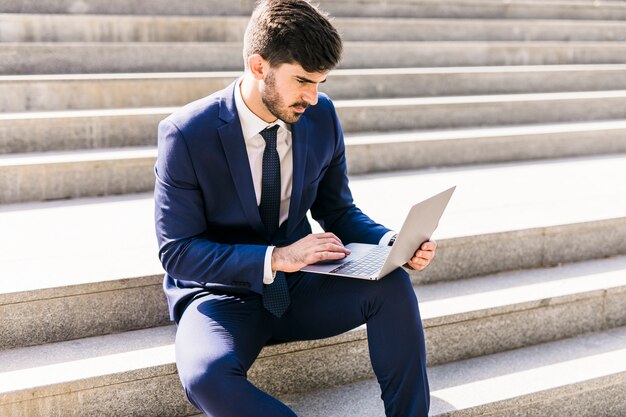 Business man using his laptop