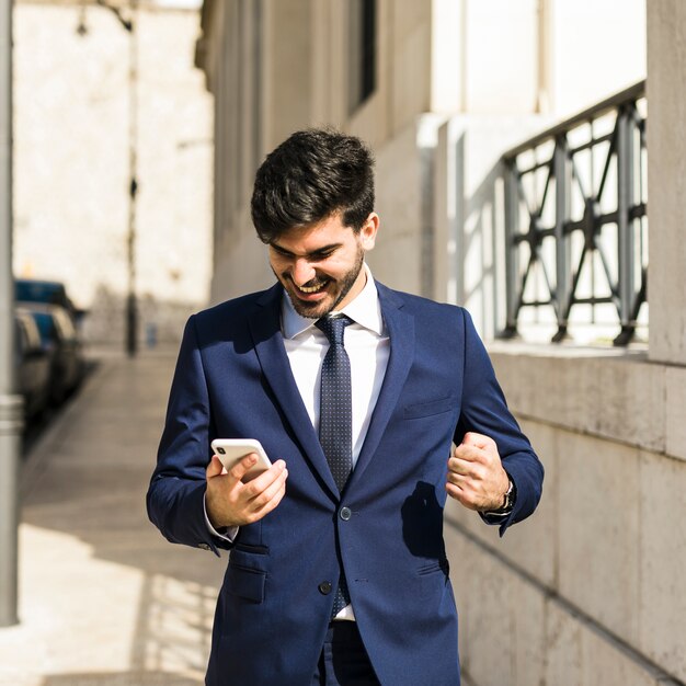 Business man using his smartphone