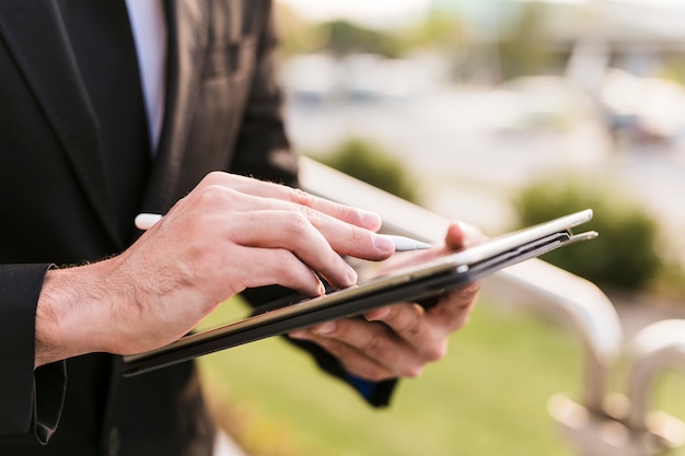 Business man using his tablet