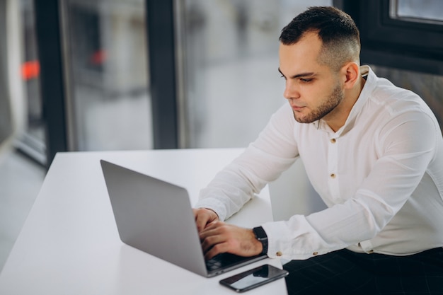 Business man using laptop in office