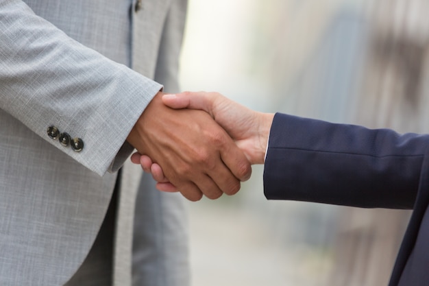 Free photo business man and woman greeting each other