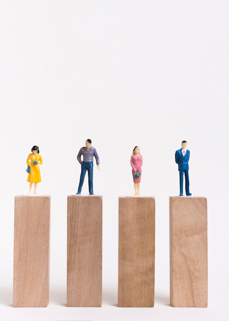 Business man and woman sitting on equal pieces of wooden