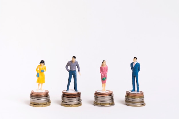 Free Photo business man and woman sitting on equal piles of coins