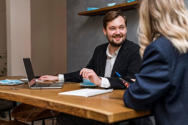 Business man and woman talking about a work project