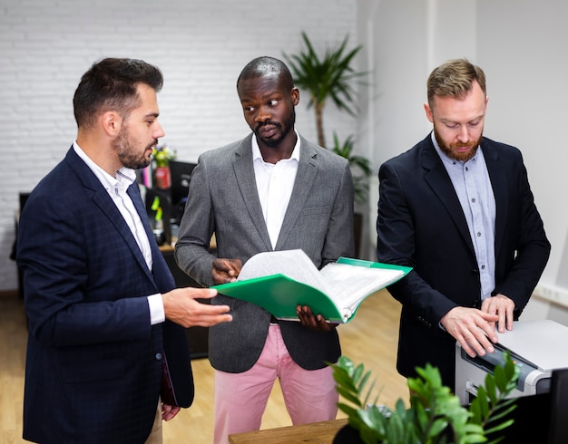 Business men checking folders