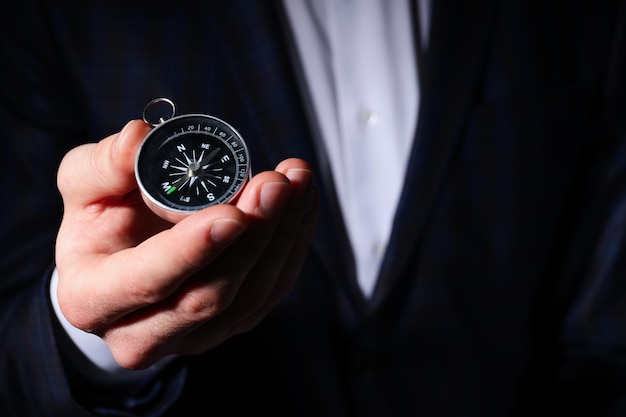 Free Photo business navigate concept with compass in businessman hand