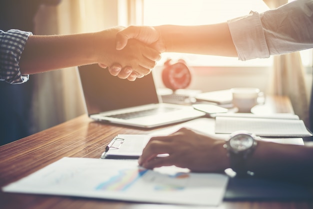 Free photo business people handshake greeting deal at work.