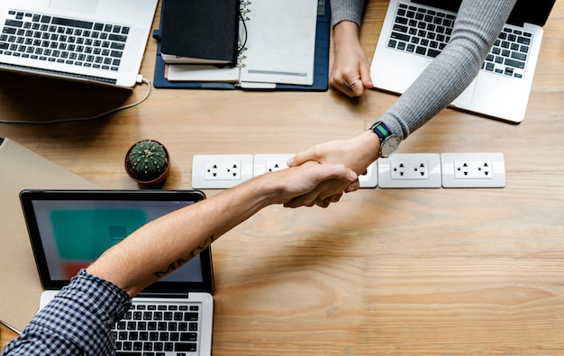 Business people shaking hands in agreement