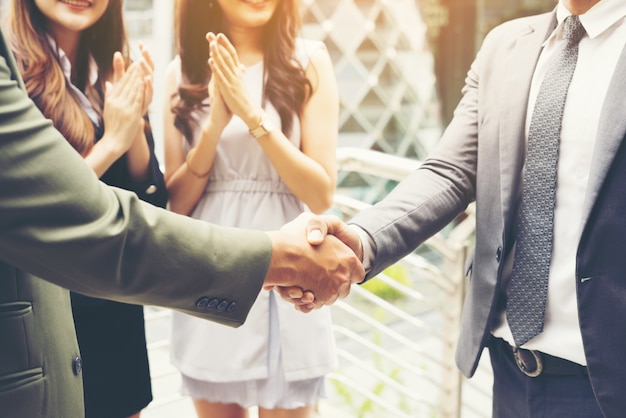 Free Photo business people shaking hands, finishing up a meeting success deal.