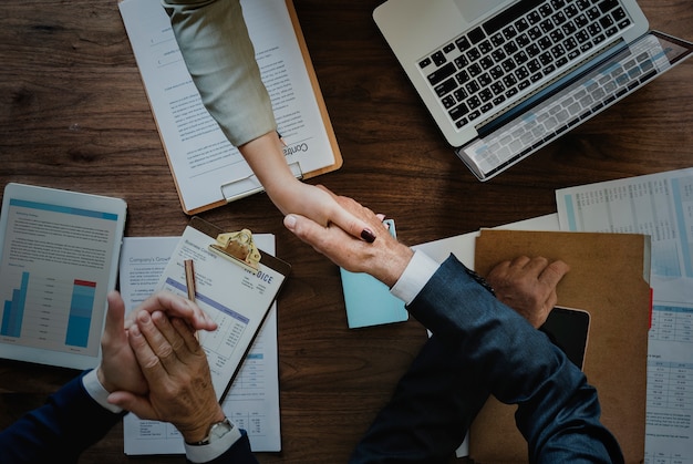 Free Photo business people shaking hands together