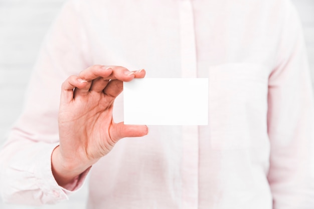 Business people showing blank business card