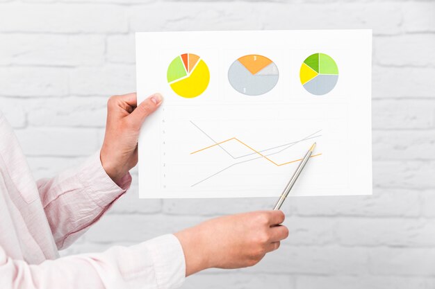 Business people showing charts and statistics