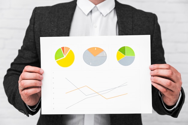 Business people showing charts and statistics