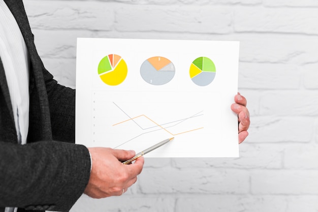 Business people showing charts and statistics