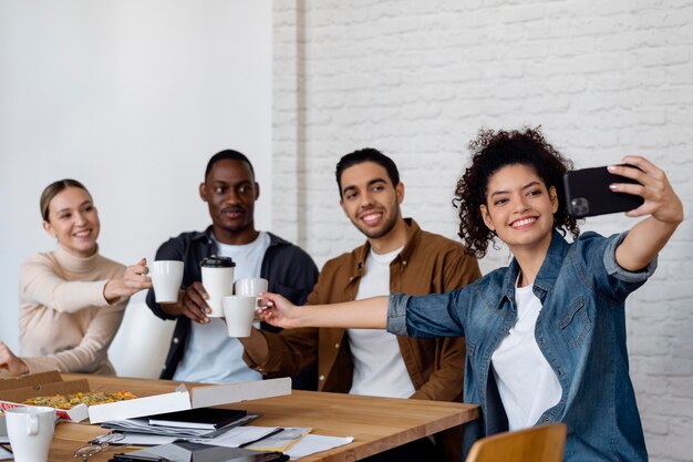 Business people taking selfie medium shot