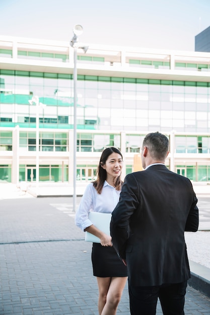 Business people talking outside