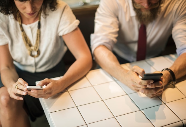 Free Photo business people using the phone at coffee shop