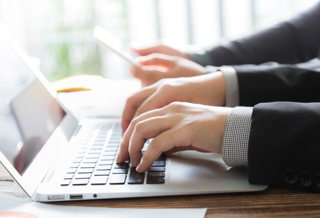 Business people with a laptop and a tablet