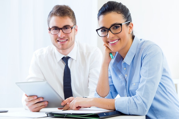 Free photo business people working in the office with digital tablet.