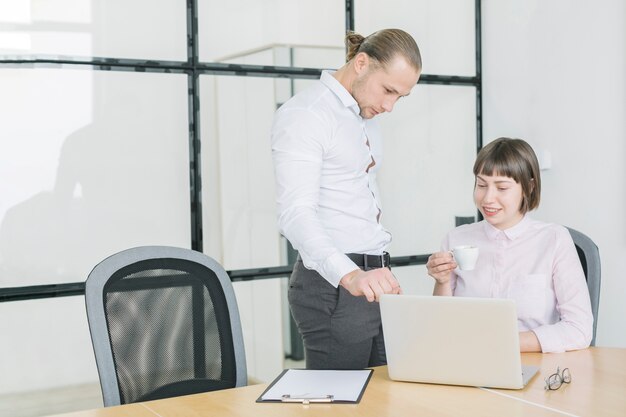 Business people working with laptop in office