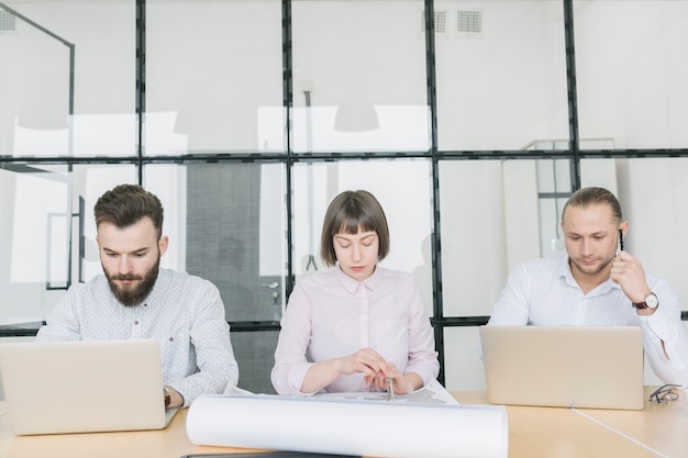 Business people working with laptop in office