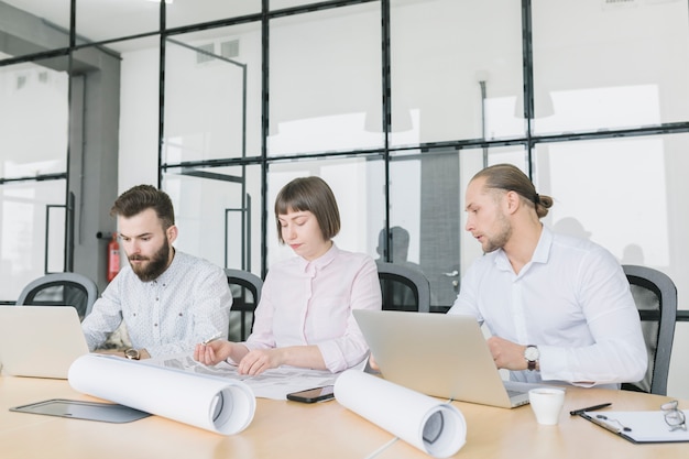 Business people working with laptop in office