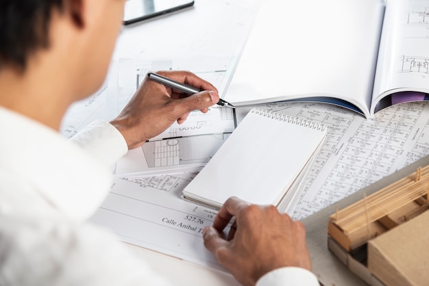 Business person writing over the shoulder view